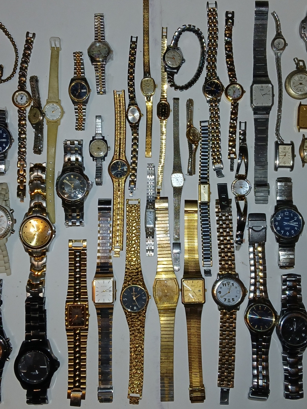 This lot of 60 mens and womans watches features a mix of vintage 10k, and 12k RG